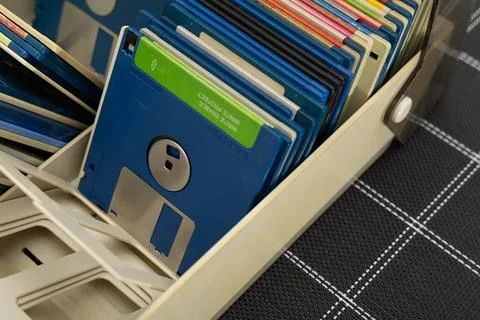 A box of old 3.5-inch floppy disks, colorful floppy disks for 8-bit compute.. Stock Photos