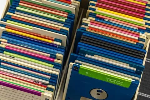 A box of old 3.5-inch floppy disks, colorful floppy disks for 8-bit compute.. Stock Photos