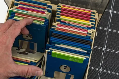 A box of old 3.5-inch floppy disks, colorful floppy disks for 8-bit compute.. Stock Photos