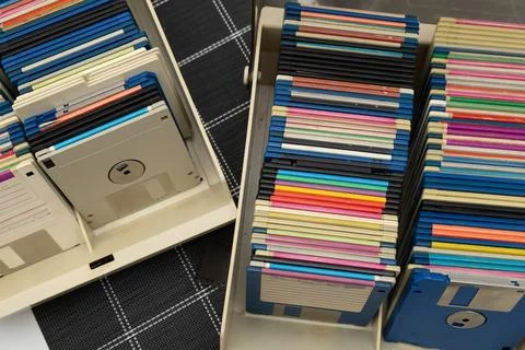 A box of old 3.5-inch floppy disks, colorful floppy disks for 8-bit compute.. Stock Photos