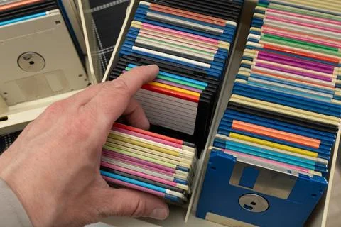 A box of old 3.5-inch floppy disks, colorful floppy disks for 8-bit compute.. Stock Photos