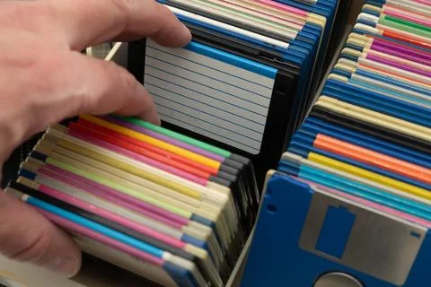 A box of old 3.5-inch floppy disks, colorful floppy disks for 8-bit compute.. Stock Photos