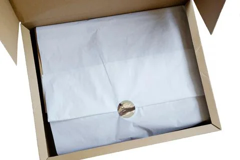 The box is open on a white background. Delivery of clothes Stock Photos