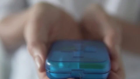 The box opens and in it lies a set of different tablets. From the blur, the Stock Footage 114192525