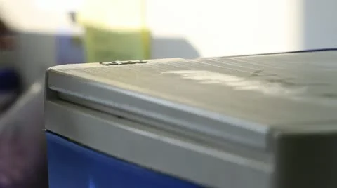 Box placed into blue cooler Stock Footage 20447179