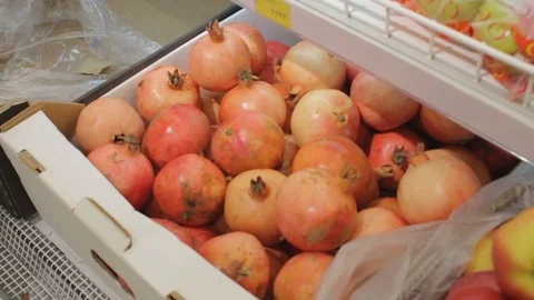 Box with pomegranates, hypermarket fridge Stock Footage 74434537