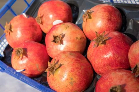 Box of pomegranates in the sun 写真素材