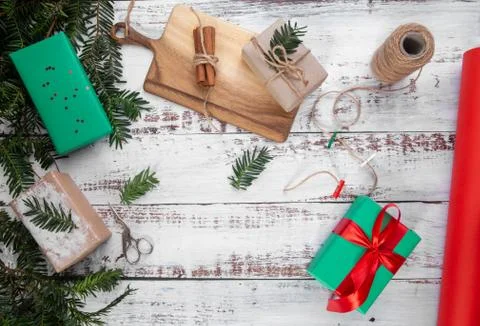 Box with a red ribbon on an old table Stock Photos