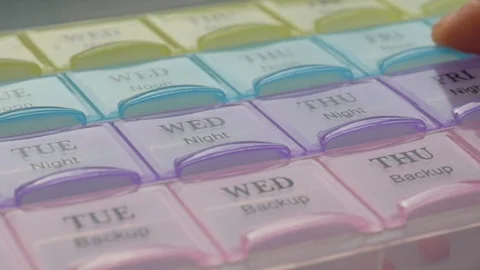 Box for the schedule of taking medications. Video stock 124770819