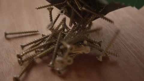 Box of Screws Emptied onto Worktop Stock Footage 170185256