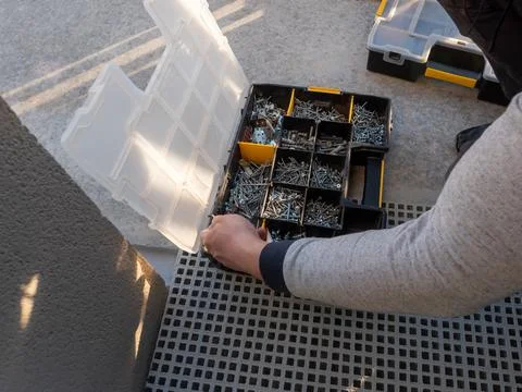 Box with screws - professional tools for the installer Stock Photos