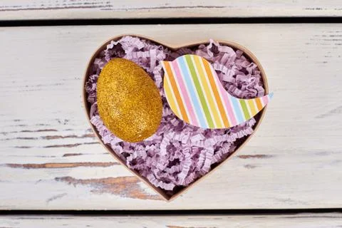 Box with sparkly Easter egg. Stock Photos