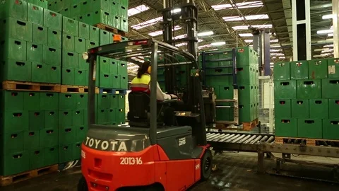 Box stack lowered on belt Stock Footage 77053972