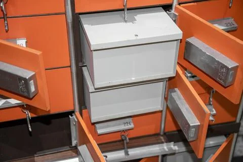 Box system in a storage space with different compartments and open drawers .. Stock Photos