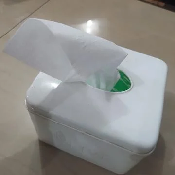 A box of tissue on a dining table is used for cleaning 스톡 사진