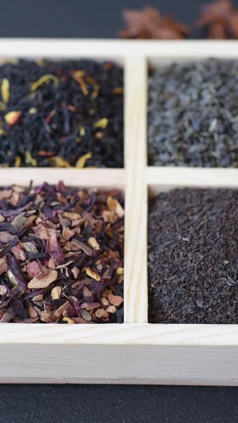 A box of various dry teas, black, green, herbal, and fruit. A set of different t Stock Footage 332767444