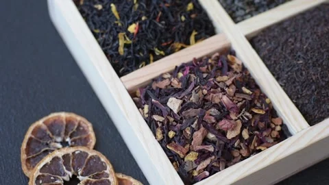 A box of various dry teas, black, green, herbal, and fruit. A set of different t Stock Footage 332767454