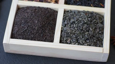 A box of various dry teas, black, green, herbal, and fruit. A set of different t Stock Footage 332767482