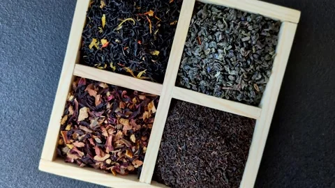 A box of various dry teas, black, green, herbal, and fruit. A set of different t Stock Footage 332767643