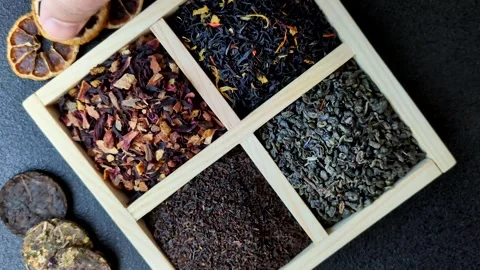 A box of various dry teas, black, green, herbal, and fruit. A set of different t Stock Footage 332767648