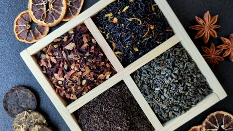 A box of various dry teas, black, green, herbal, and fruit. A set of different t Stock Footage 332767649