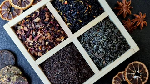 A box of various dry teas, black, green, herbal, and fruit. A set of different t Stock Footage 332767655