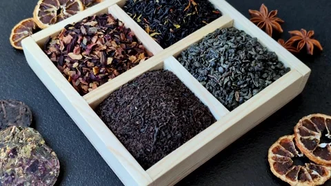 A box of various dry teas, black, green, herbal, and fruit. A set of different t Stock Footage 332767664