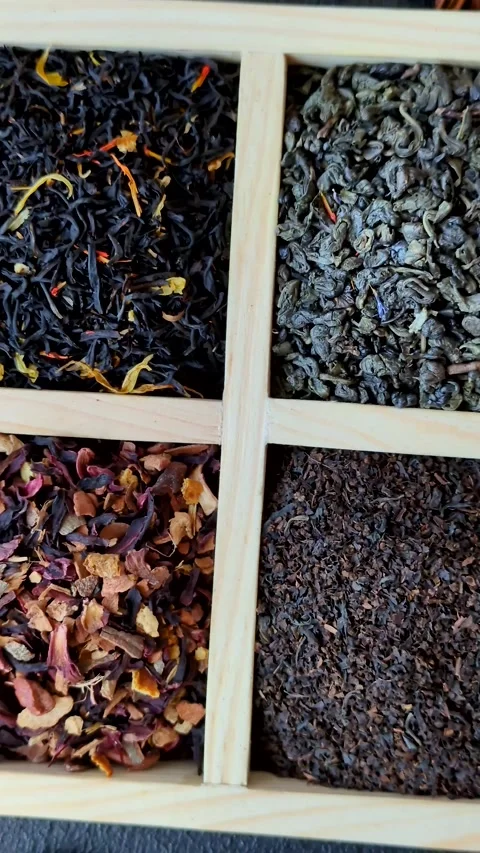 A box of various dry teas, black, green, herbal, and fruit. A set of different t Stock Footage 332767674