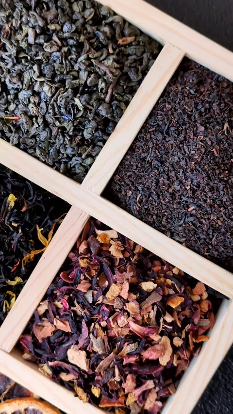 A box of various dry teas, black, green, herbal, and fruit. A set of different t Stock Footage 332767680