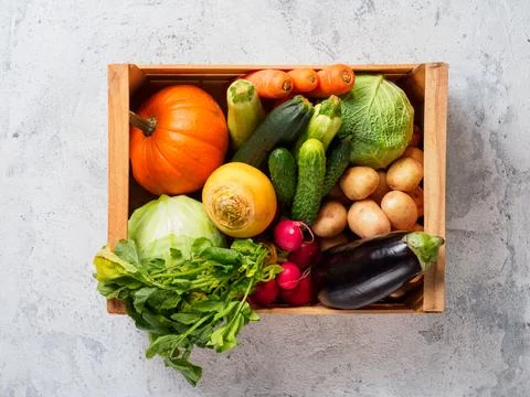 Box with vegetables on gray background. Foto stock
