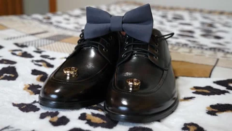 Box with wedding rings, bow tie and shoes. Preparing for the wedding Stock Footage 311113529