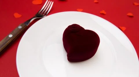 Box witha ring, table setting on a red background. Concept Valentine's Day. - Stock Photos