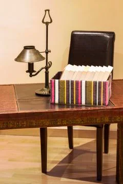 Boxed books on a desk Stock Photos