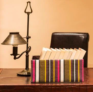 Boxed books with lamp Stock Photos