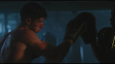 Boxer and trainer training in boxing ring Stock Footage 275089160
