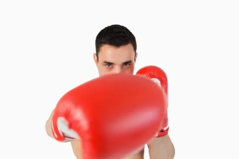 Boxer attacking with right fist Stock Photos