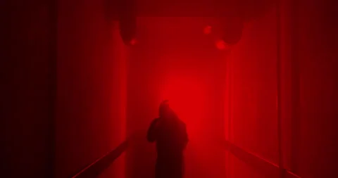Boxer boxing with a shadow in a semi-dark corridor with a red illumination behin Stock Footage 157898638