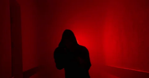 Boxer boxing with a shadow in a semi-dark corridor with a red illumination behin Stock-Footage 157898948