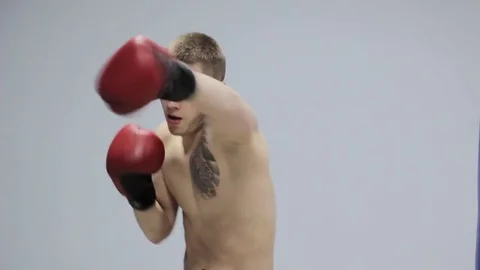 Boxer coaches on boxing pear Stock Footage 82304754