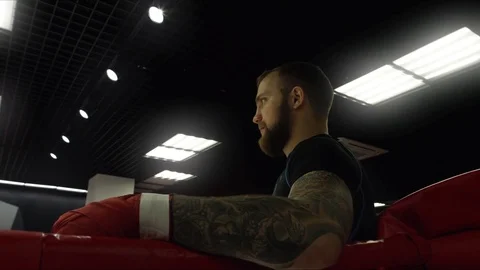 Boxer in the corner of the ring looking at the camera Stock Footage 75025379
