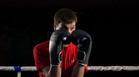 Boxer doing fight with shadow in the ring, slow motion  1 Stock-Footage 65762160