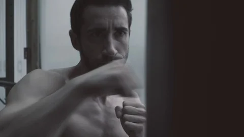 Boxer exercising with a punching bag Stock Footage 127436353