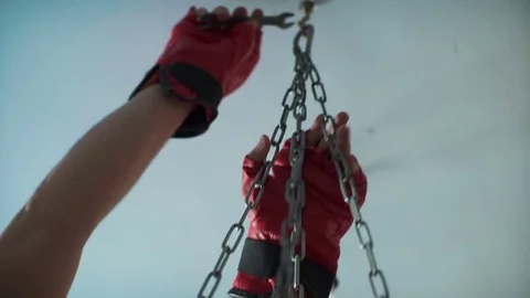 Boxer hangs a pear to the ceiling Video stock 74404766