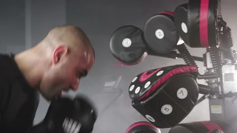 Boxer Heavy Hitting BoxMaster Punching Machine Stock Footage 174927147
