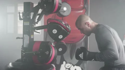 Boxer Heavy Hitting BoxMaster Punching Machine Stock Footage 174927201