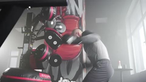 Boxer Heavy Hitting BoxMaster Punching Machine Stock Footage 174927570