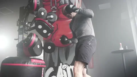 Boxer Heavy Hitting BoxMaster Punching Machine Stock Footage 174927571