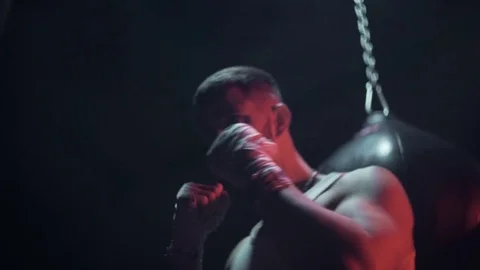 Boxer hits punching bag Stock Footage 80862090