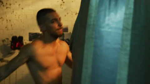 Boxer hitting the punching bag Stock Footage 100036864