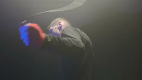 A boxer jumping with a rope preparing to training session. A fighter man Stock Footage 161047863